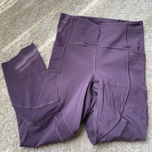 purple cropped lulu leggings with mesh and pockets